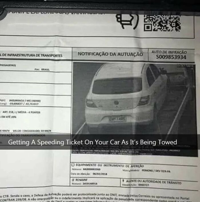 Speeding ticket issued for a car caught speeding while being towed on a busy road in Brazil.