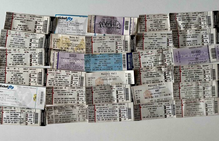 Collection of unusual concert tickets arranged neatly, showcasing one of the most interesting collections people have at home.