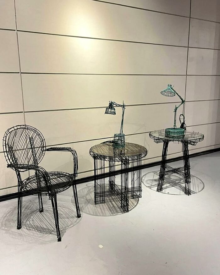 Wireframe style furniture pieces including a chair, tables, and lamps resembling doodles from a notebook.