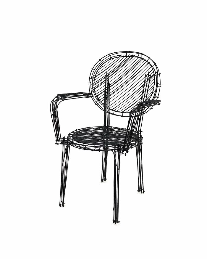 Black wireframe chair designed to look like doodles, inspired by furniture pieces resembling notebook sketches.
