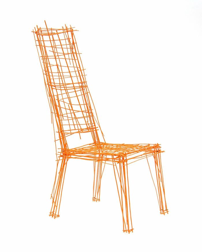 Orange wireframe chair resembling doodle-style furniture piece inspired by notebook sketches by Jinil Park on white background.
