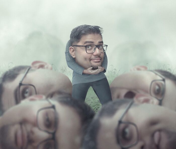 Man with multiple large heads surrounding a small body, showcasing humorous Photoshop skills and creativity outdoors.