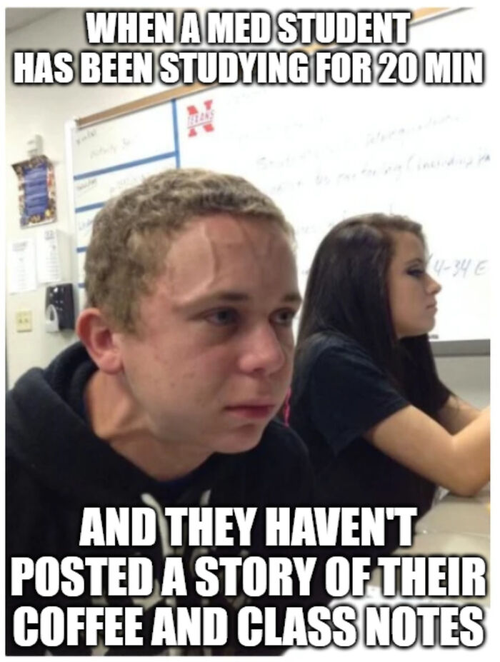 Med student struggling to study, stressed expression in classroom, a relatable painful medical school meme for future doctors.