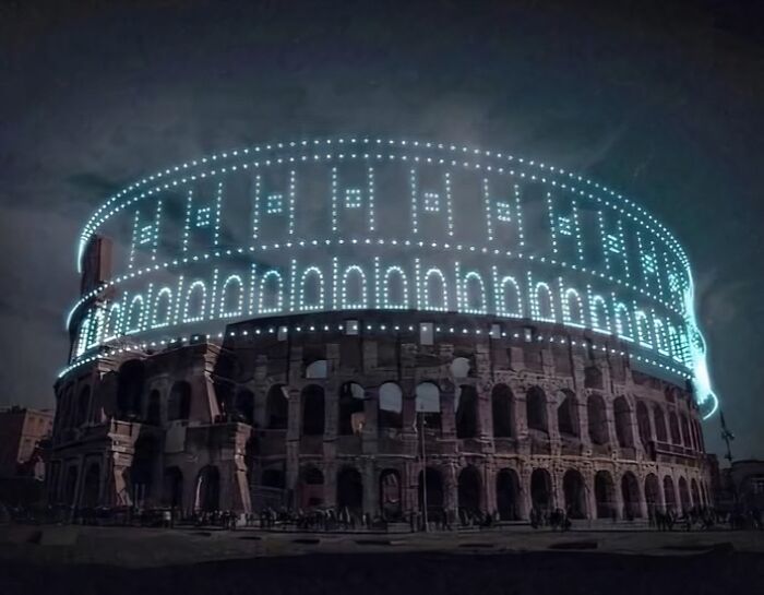 Colosseum at night with digital light rendering highlighting its archeological and art features.