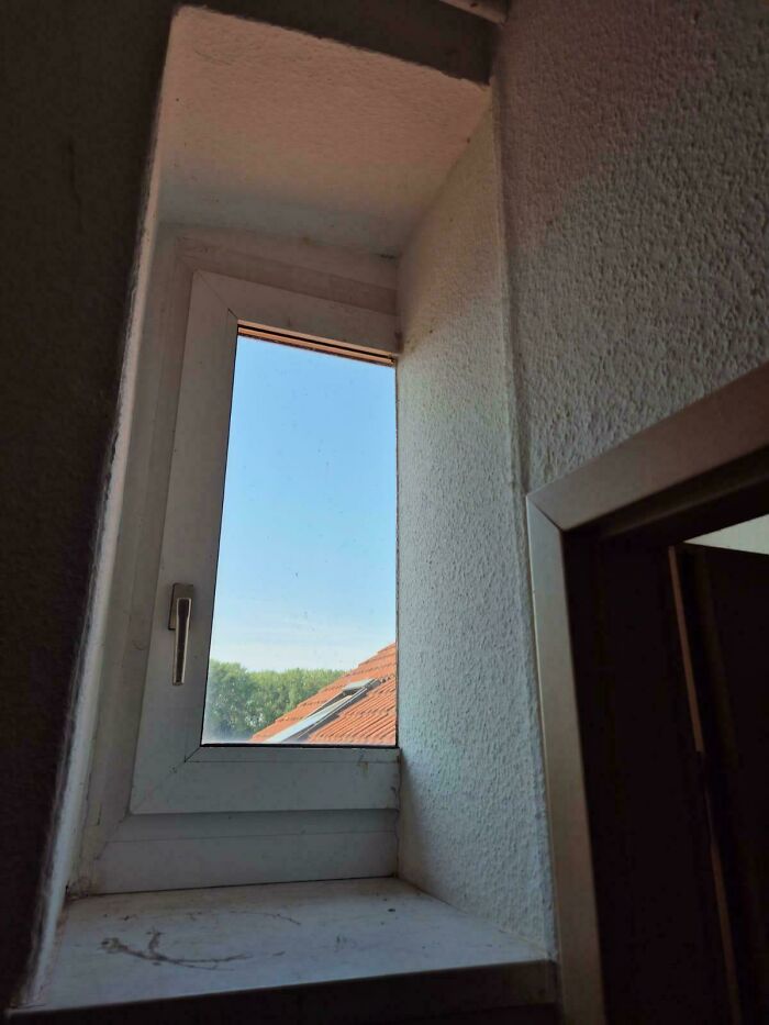 Narrow window design with limited natural light illustrating dumb interior design decisions in a small space.