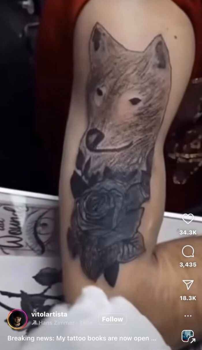 Tattoo of a wolf and rose on a forearm, showcasing a cool ink design that ended up being a permanent mistake.