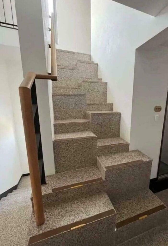 Confusing interior design with irregular and unsafe stairs showing a poor common sense design decision.