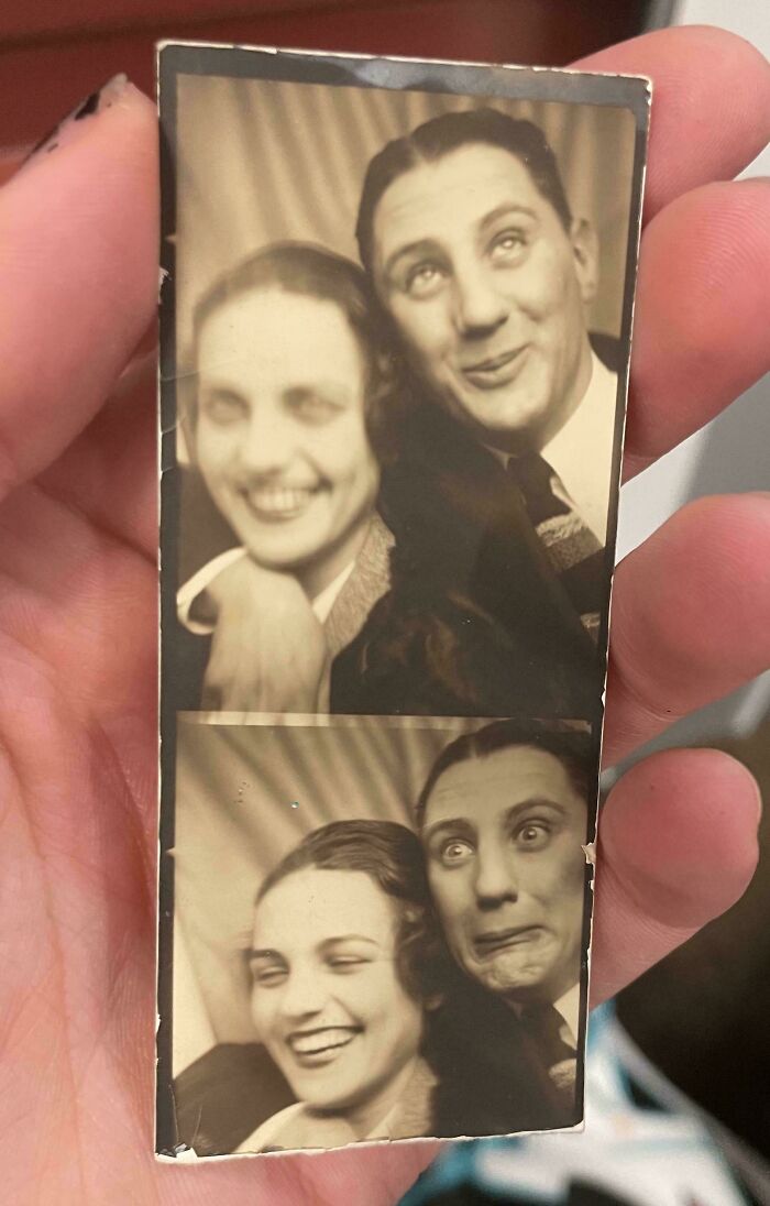 Hand holding a vintage found photo strip of a smiling couple making playful faces, people share found photos.
