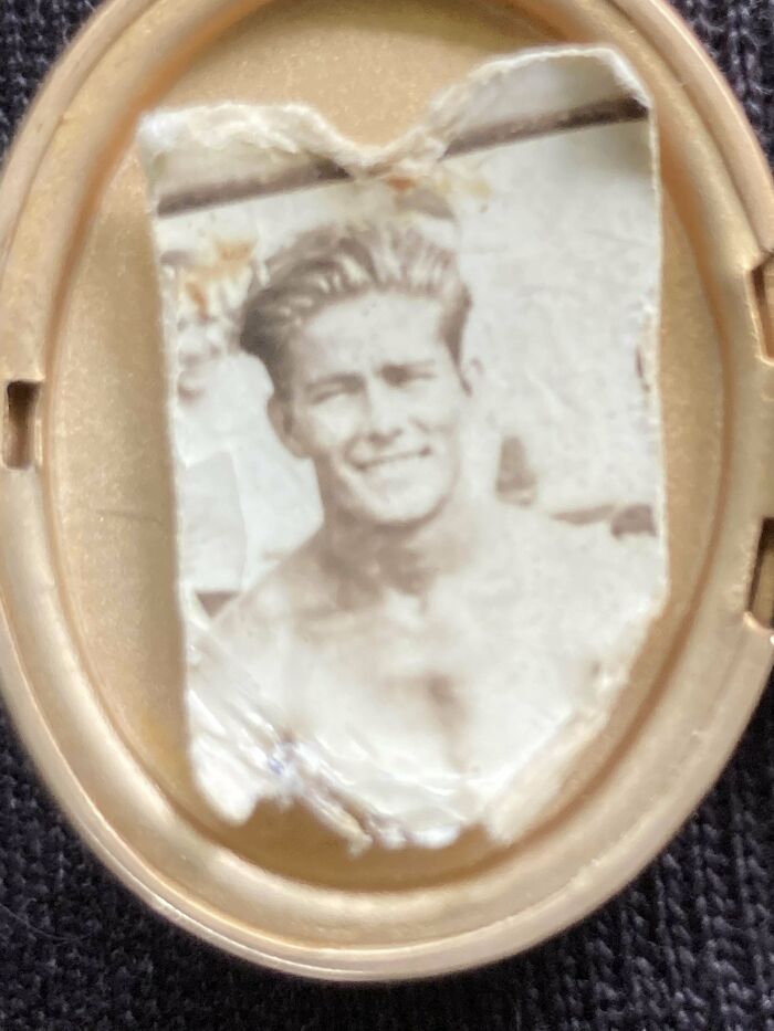 Faded found photo of a smiling young man in an old oval frame shared by people.