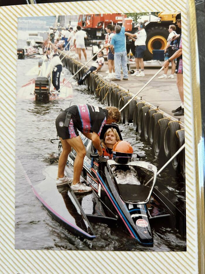 People share found photos of a boat race with a racer receiving support on the water near a dock with spectators.