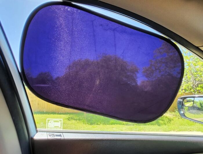 Car window sunshade installed on side window, demonstrating a popular Amazon movers and shakers product for sun protection.