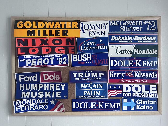 Collection of vintage political campaign bumper stickers displayed on a home wall showcasing unusual collections.