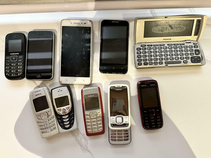 Collection of vintage and modern mobile phones showcasing unusual collections people have in their homes.