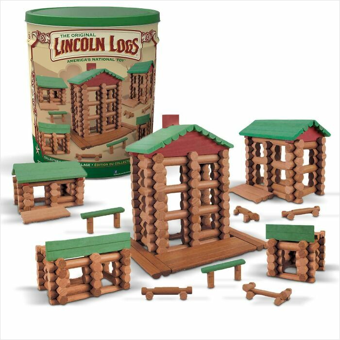 Lincoln Logs nostalgic wooden toy set with small log cabins and green roofs, evoking childhood memories and nostalgia.