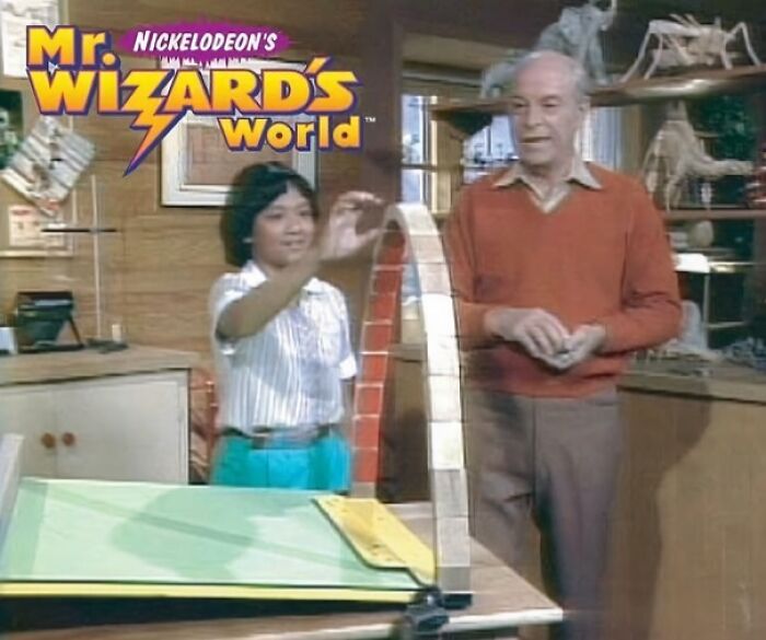 Scene from nostalgic Nickelodeon show Mr. Wizard's World featuring a boy and an older man demonstrating a science experiment.