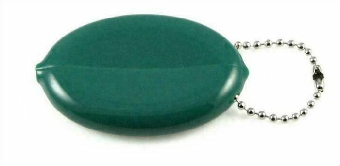 Green plastic keychain coin holder with attached silver ball chain, a nostalgic item from past decades.
