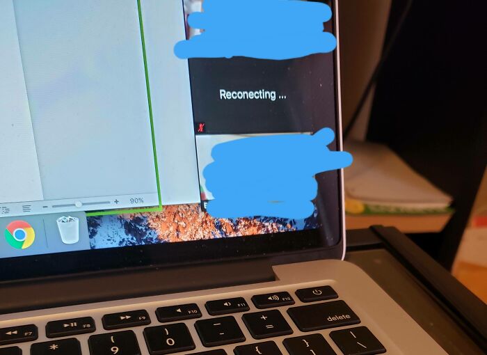 Laptop screen showing a reconnection message during a video call, illustrating challenges in work-from-home memes.