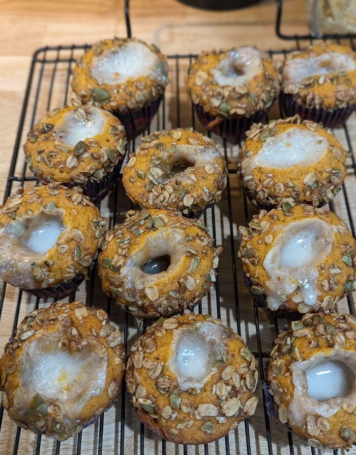 Baked muffins with sunken centers and oats topping, showcasing a humorous cooking fail in the kitchen.