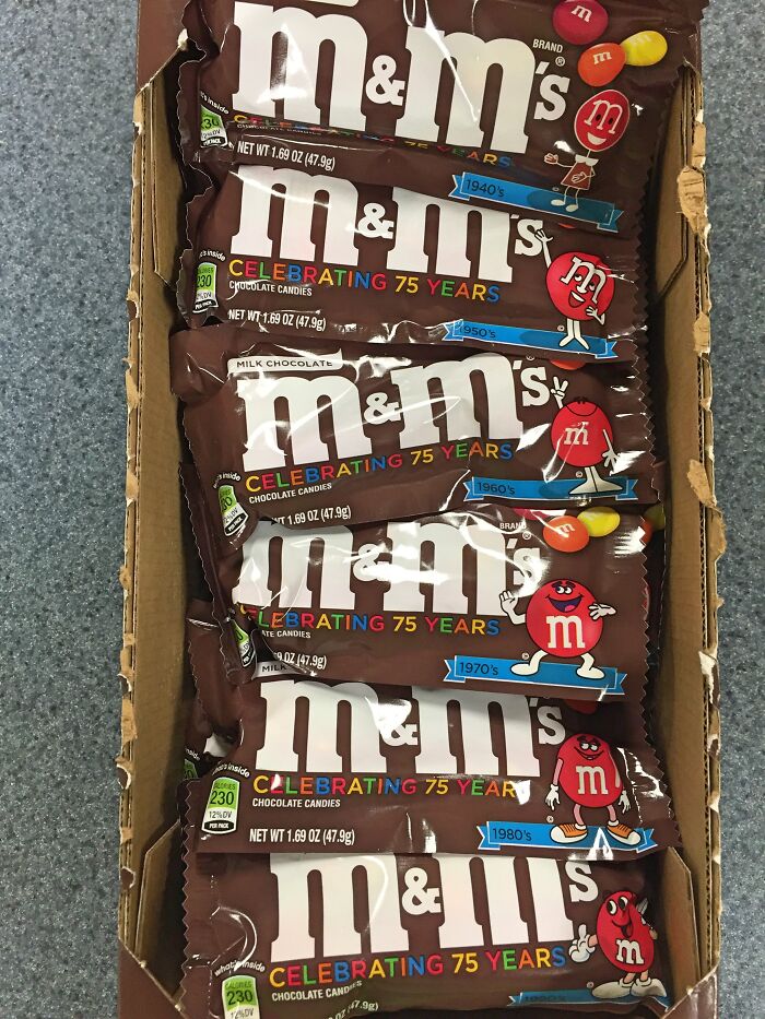 M&M's candy bars in a box, each package celebrating 75 years with vintage designs from the 1940s to 1980s.