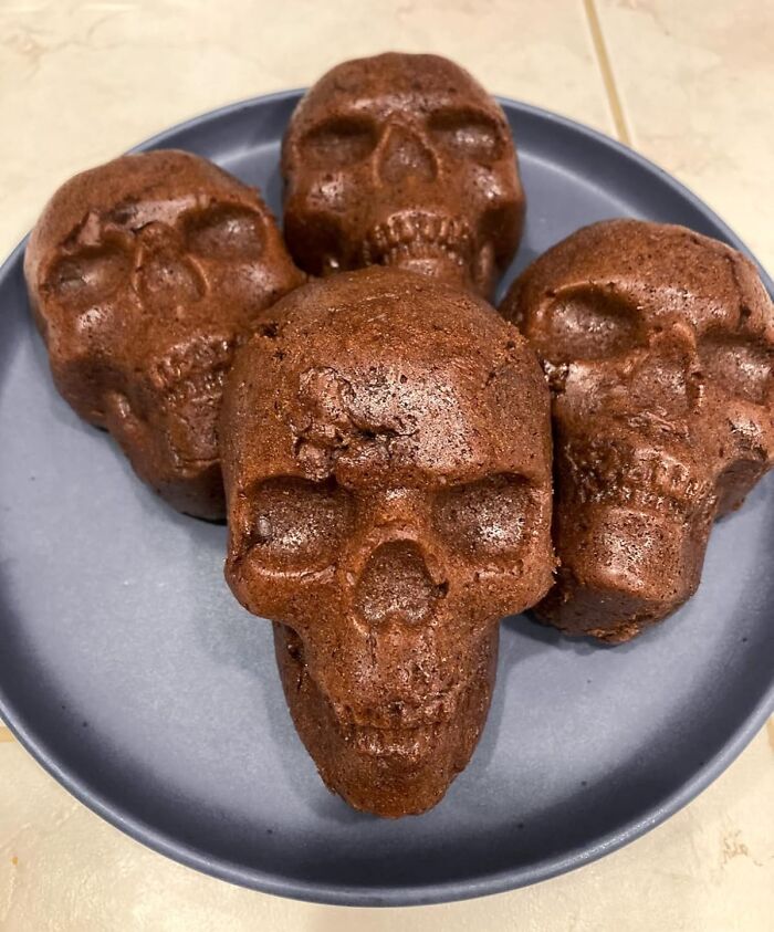 Skull-shaped chocolate cakes on a plate, an example of ridiculous purchases that just kind of make sense.