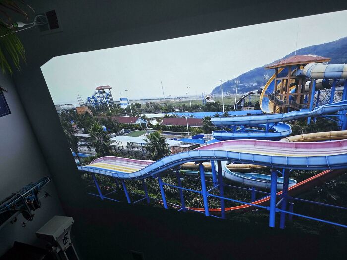 Colorful waterslides at an outdoor water park showcasing creative and unusual DIY projects in recreational design.