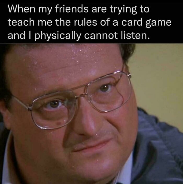 Man sweating nervously while trying to understand card game rules, a relatable meme about the human experience.
