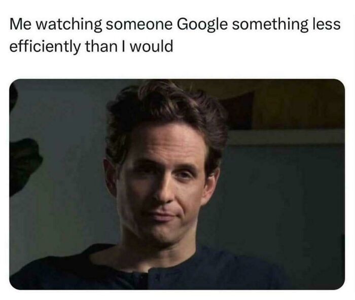 Man with skeptical expression watching someone search inefficiently online, illustrating memes encapsulating the human experience.