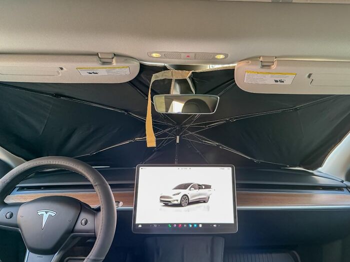 Car sunshade installed inside a Tesla, one of the popular Amazon finds living rent-free on wishlists right now.