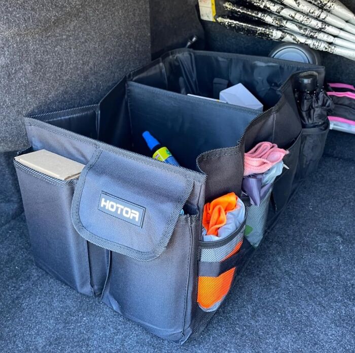 Car trunk organizer with multiple compartments, showcasing popular Amazon finds neatly stored and easily accessible.