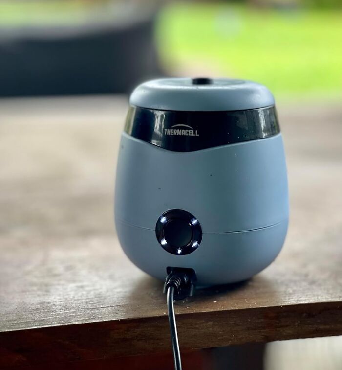 Compact Thermacell mosquito repellent device on wooden surface, one of the top Amazon finds on popular wishlists.