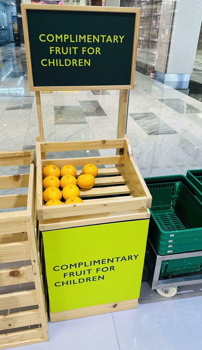 Complimentary fruit basket creatively placed for children promoting clever solutions to overlooked issues in public spaces.