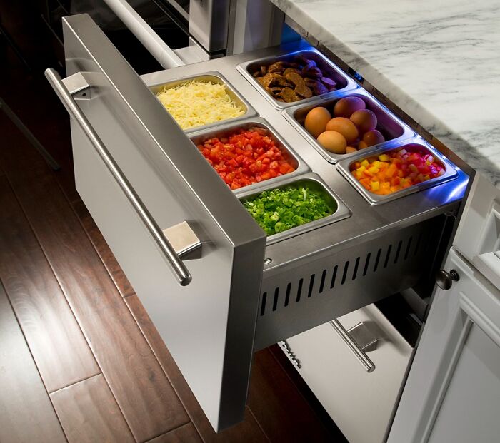 Kitchen drawer with organized food containers demonstrating clever solutions for overlooked storage issues