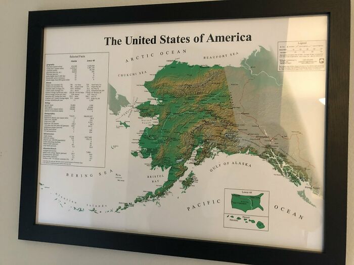 Framed detailed topographic map of Alaska highlighting geographic features and key facts in the United States of America.