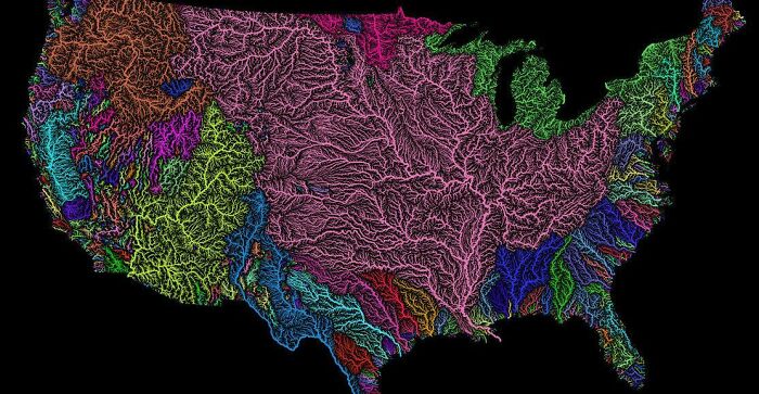 Colorful detailed map of America showing major river basins and drainage patterns, highlighting geographic features.