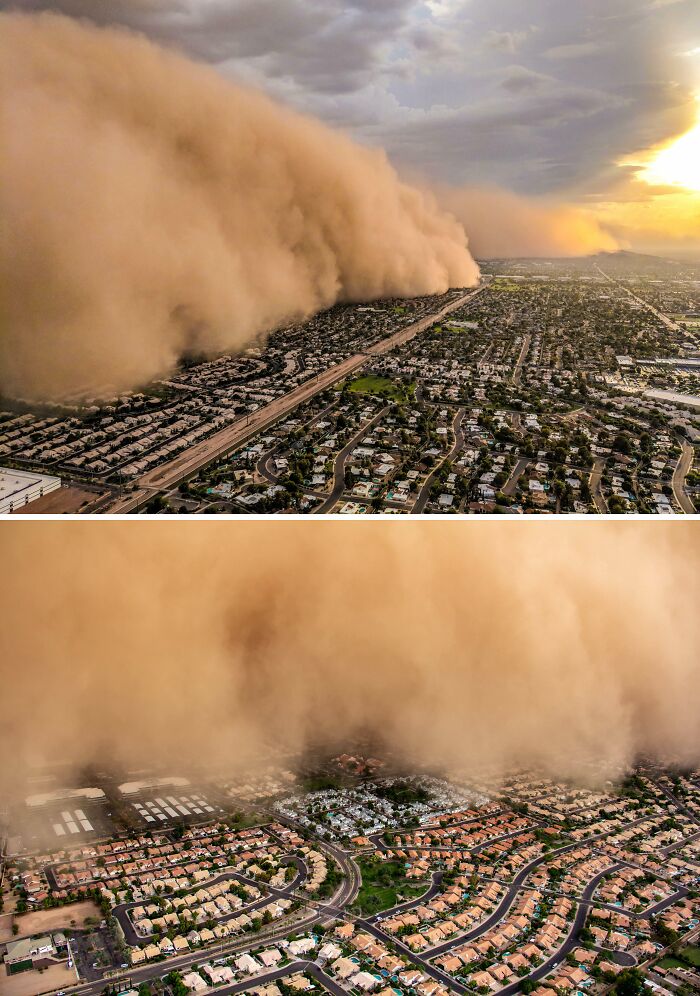 A massive dust storm, a rare natural phenomenon, rolling over a suburban cityscape during sunset.
