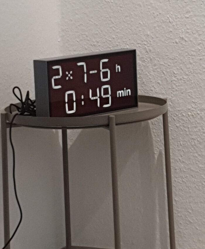 Digital clock showing incorrect time with numbers 2 x 7 - 6 h 0:49 min, symbolizing mildly infuriated mood.