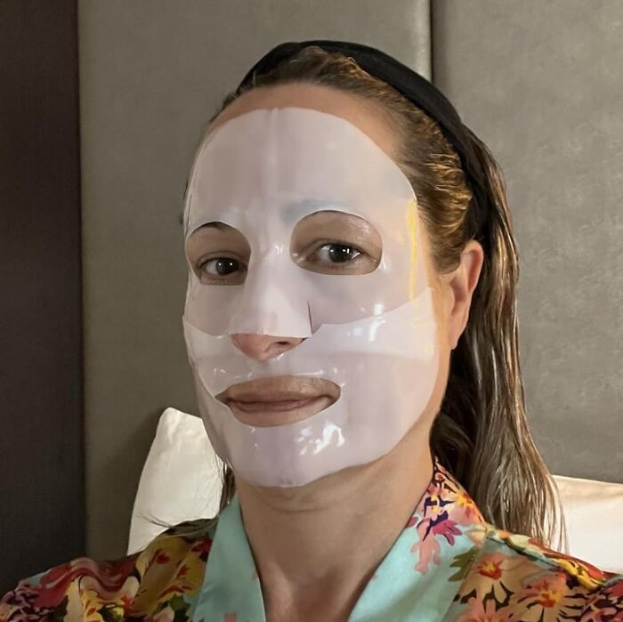 Person wearing a white facial mask relaxing indoors, showcasing popular Amazon finds trending on wishlists right now.