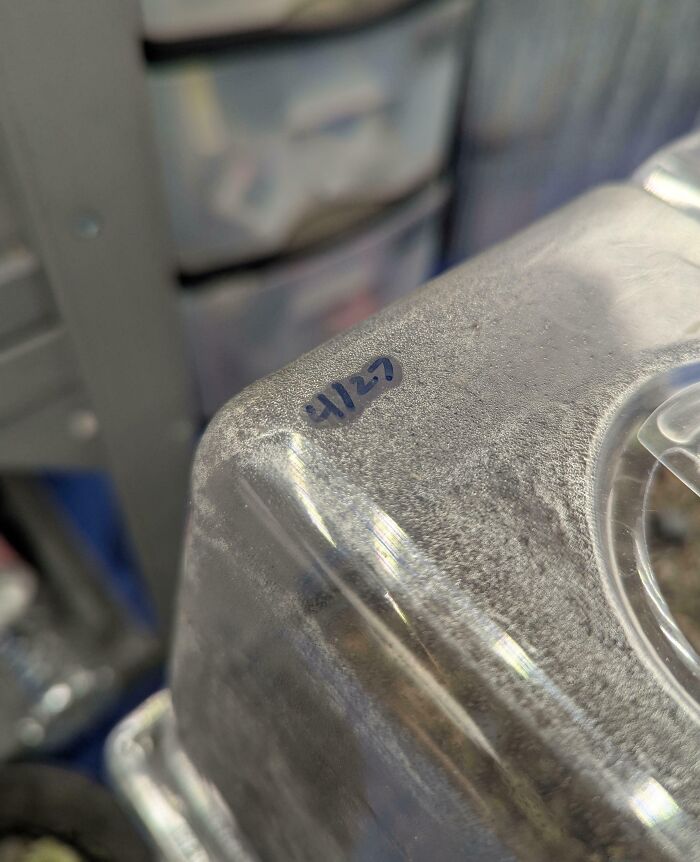 Close-up of a creative solution using a small label to organize and solve overlooked issues efficiently.