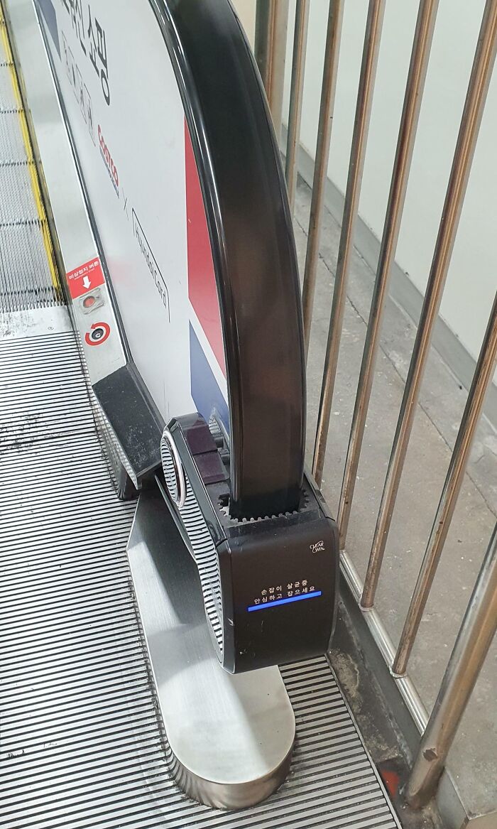 Escalator handrail with built-in fan innovation as a clever solution to overlooked user comfort issues.