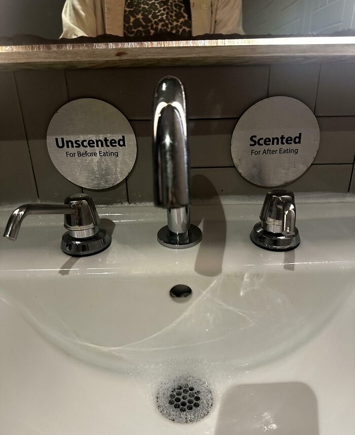Sink faucet with clever labels showing unscented soap for before eating and scented soap for after eating, a smart solution.