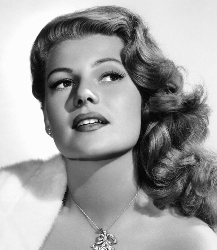 Glamorous 1940s Hollywood icon with vintage hairstyle and elegant expression, embodying classic golden age beauty.