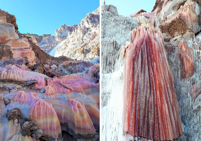 Colorful mineral formations in a rocky landscape showcasing rare natural phenomena under a clear blue sky.