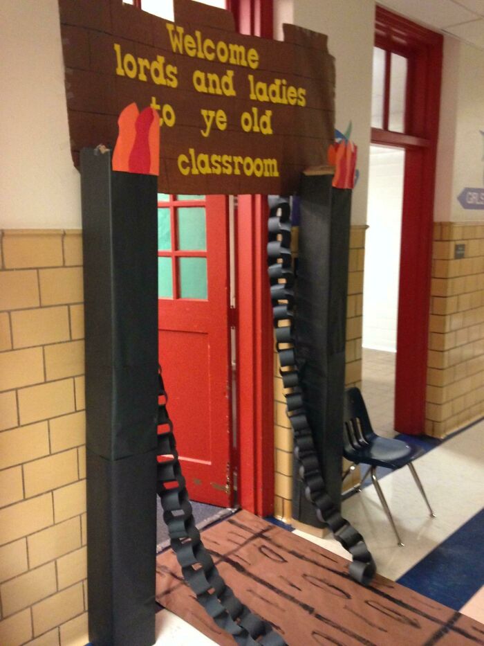 Classroom entrance decorated by teacher with medieval theme, showing creativity and love for students and teaching profession.