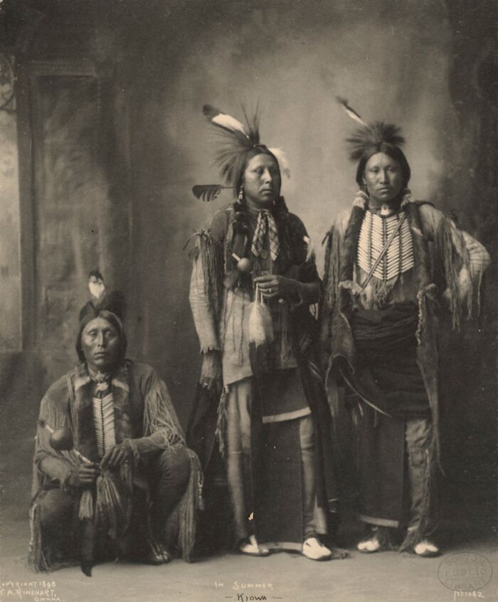 Three Native American men in traditional attire, featured in powerful historic portraits of Native American men.