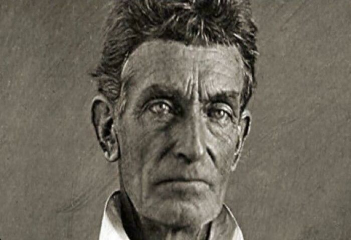 Black and white portrait of an elderly man with serious expression, illustrating chaotic good people with best intentions.