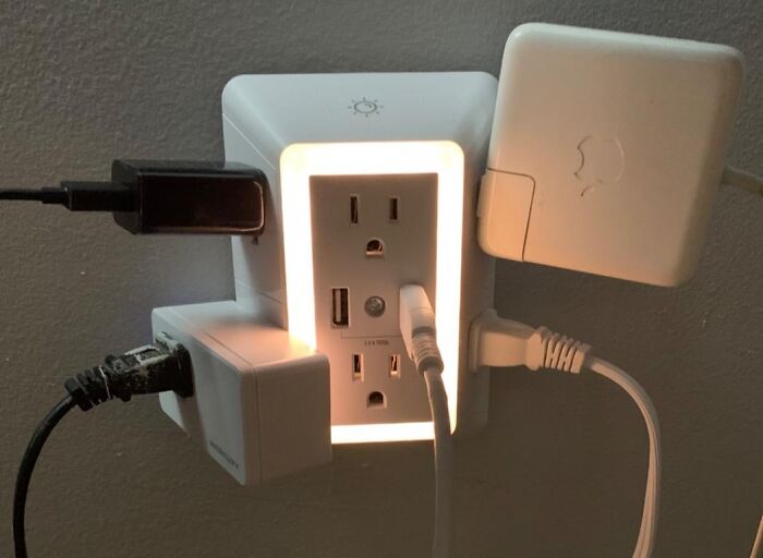 Smart outlet with multiple plugs and USB ports connected, illustrating innovative discoveries for making fancy lemonade.