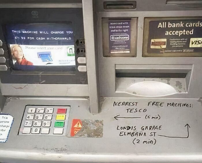 ATM with handwritten directions to nearest free machines, showing chaotic good acts with best intentions in public spaces.