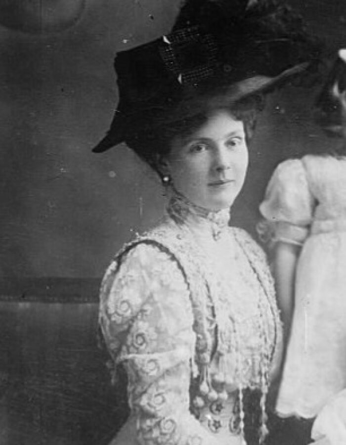 Black and white photo of a royal woman in Victorian attire and a large hat, illustrating historical royals facts.