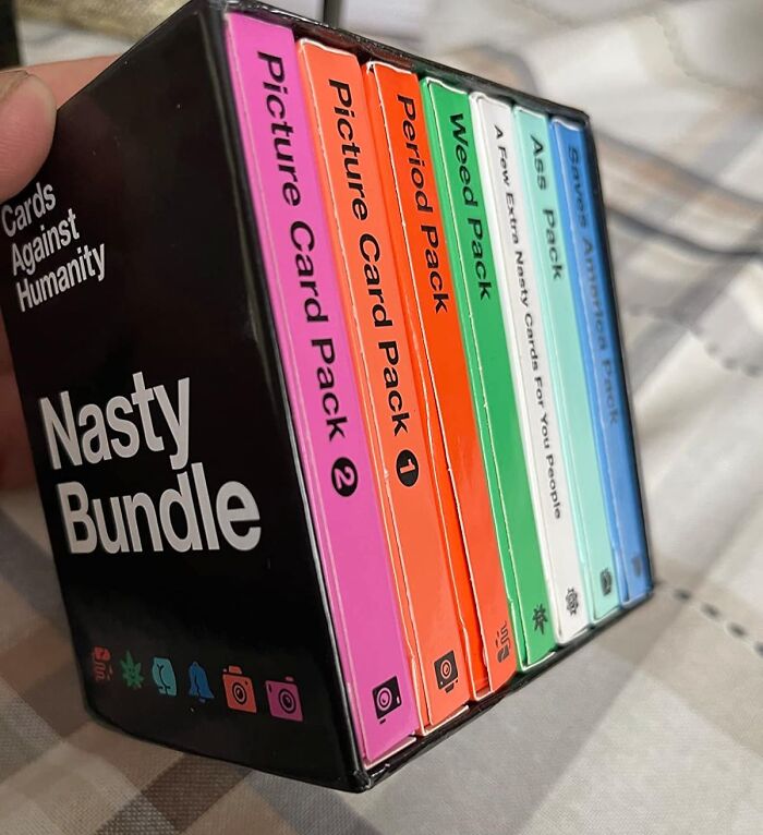 Cards Against Humanity Nasty Bundle gift set with various themed packs, perfect for celebrating unhinged friendship moments.