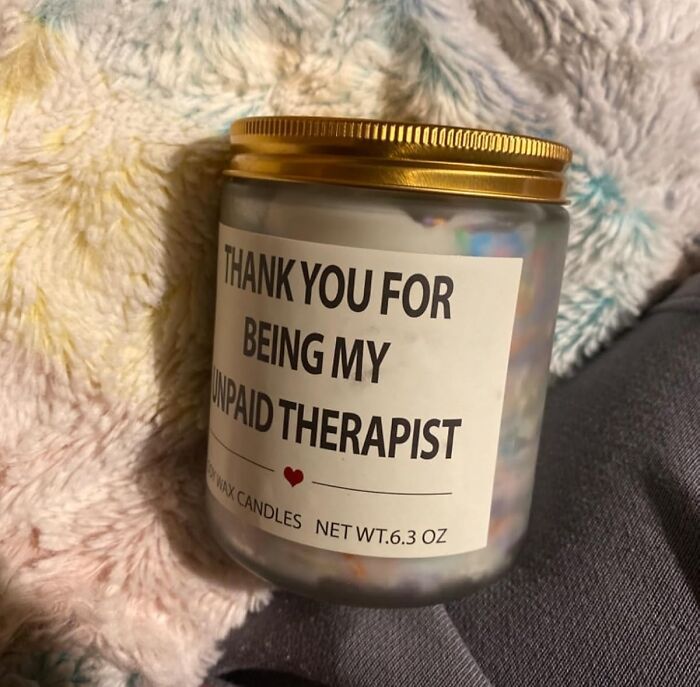 Candle jar with a gold lid and a label reading thank you for being my unpaid therapist, gift for friendship.
